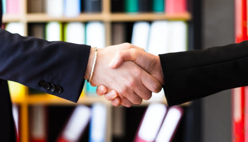 Two people shaking hands - Lead generation is the first step in business relationship building