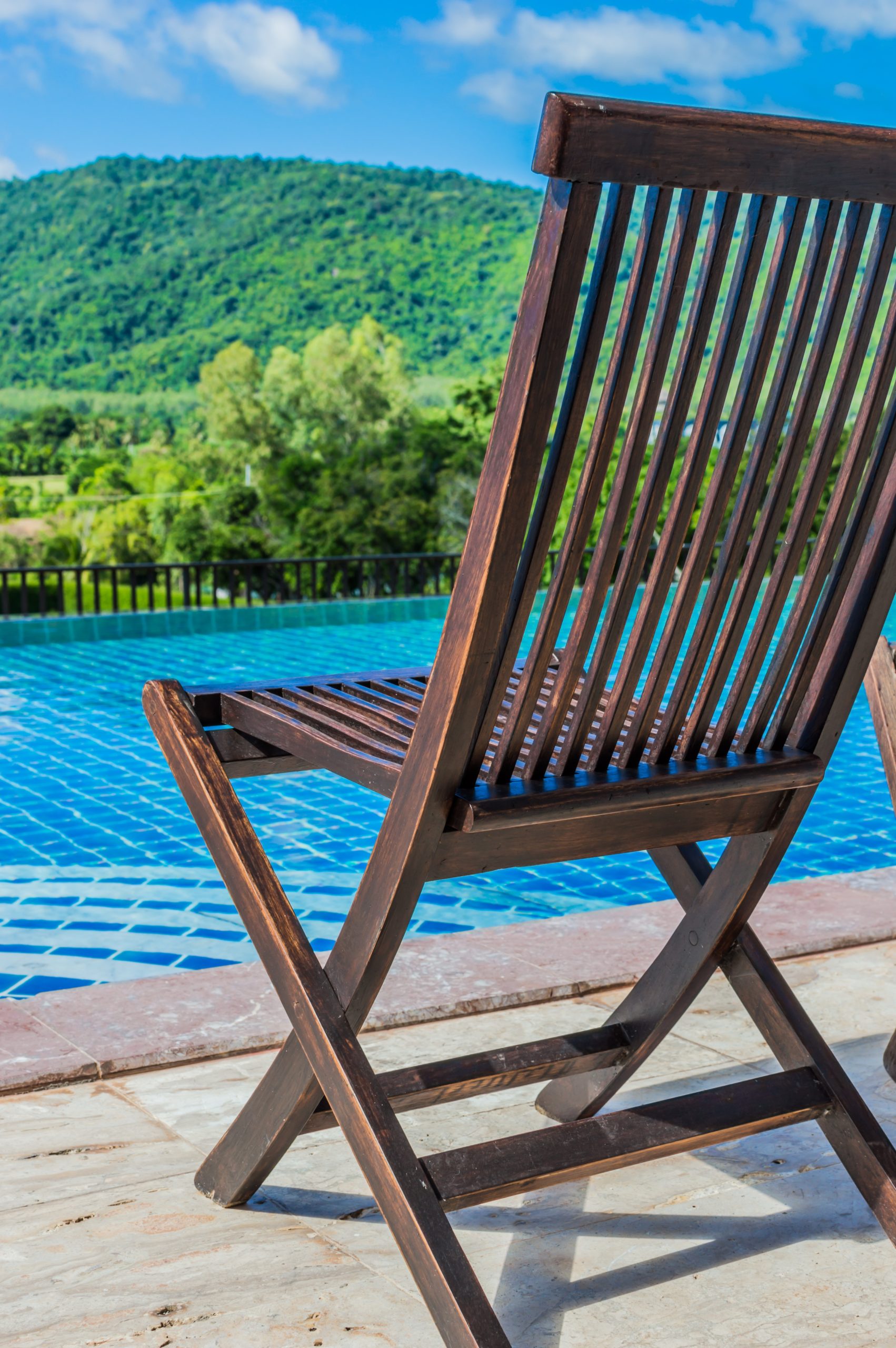 Wooden Chair Poolside - Use VoIP Phones at Home to Work Outside