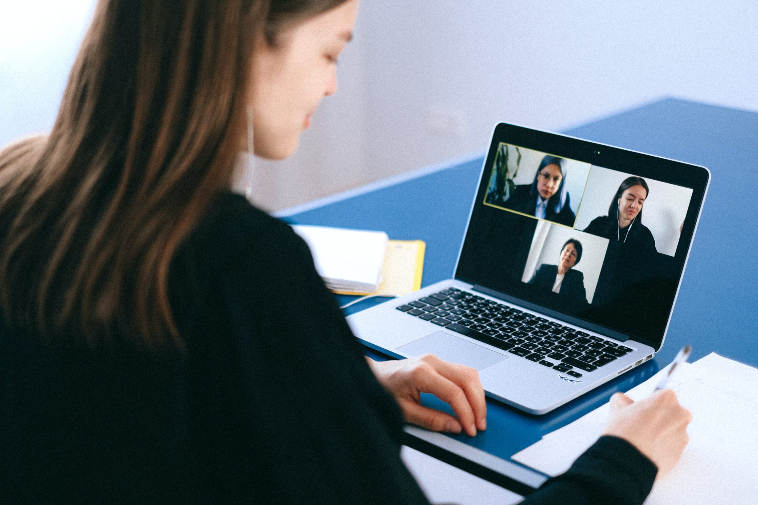 Woman on Video Call - Hybrid Work Means Combining Remote and In-Office Work
